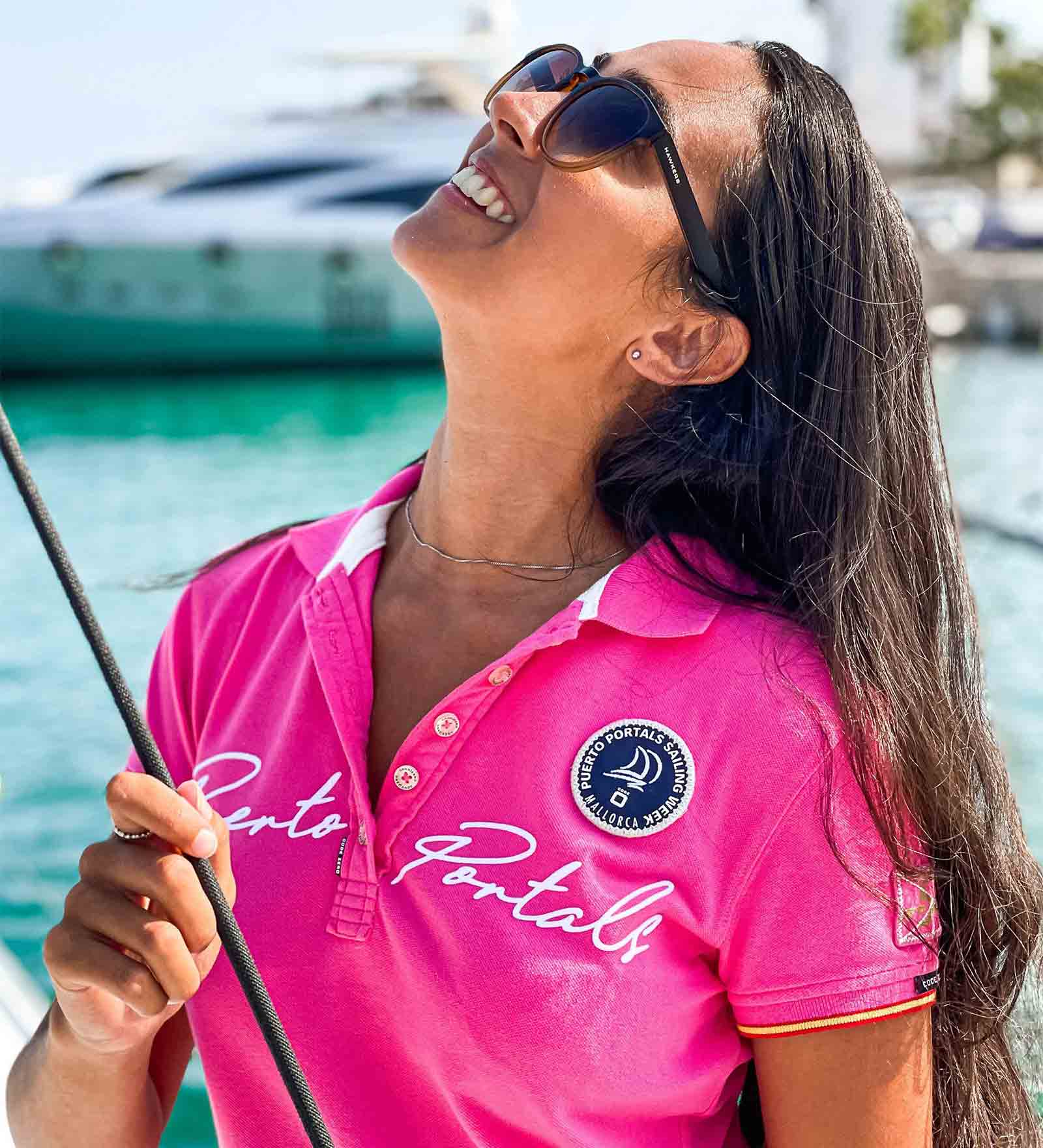 Woman wearing a pink polo shirt in Puerto Portals