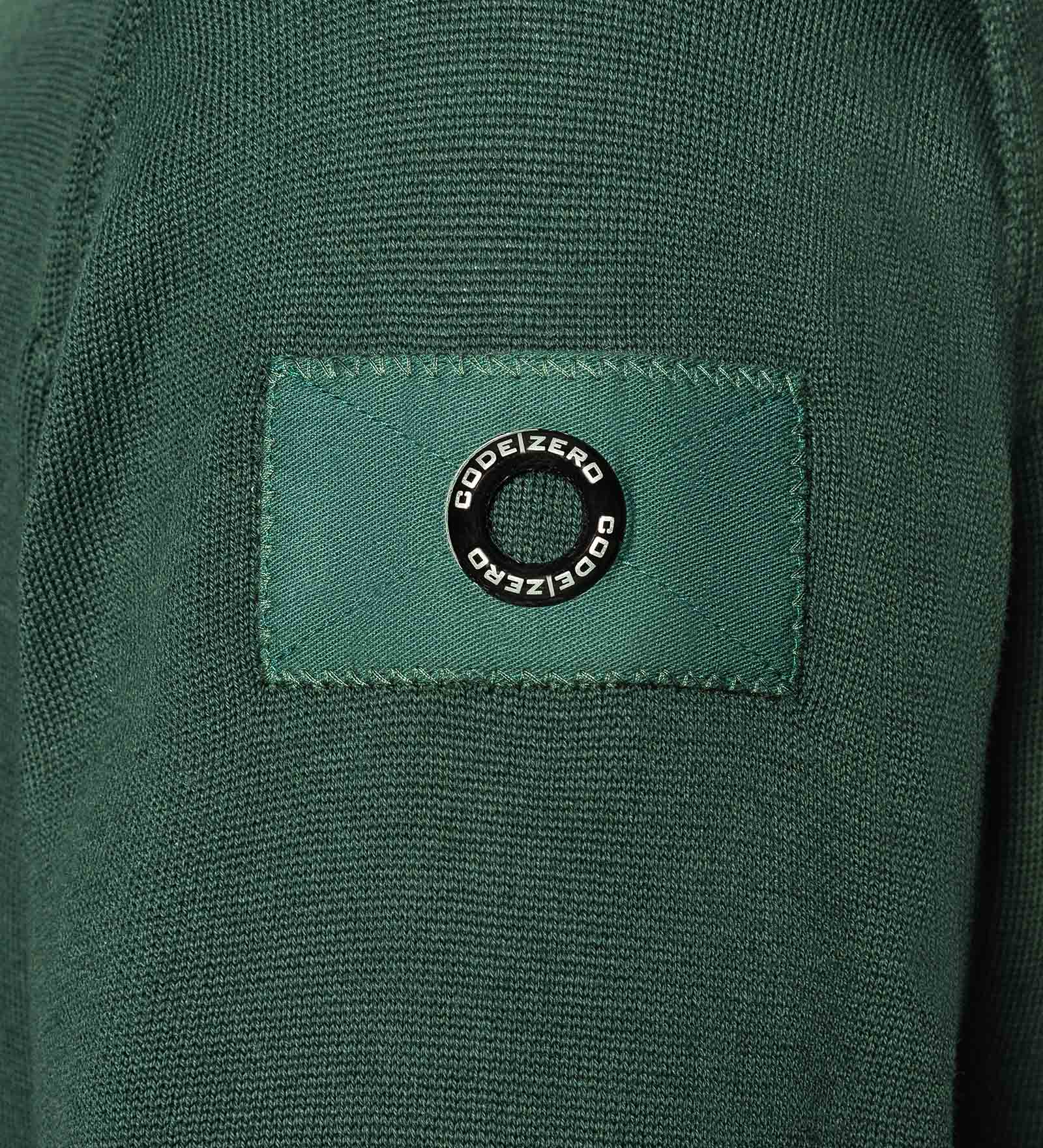 Eyelet of a green jumper